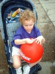 Savannah plays with a red ballon_th.jpg 5.3K